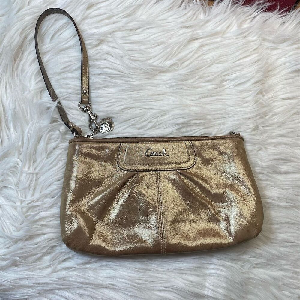 Coach Women's Gold Leather Wristlet with Signature Logo Detailing